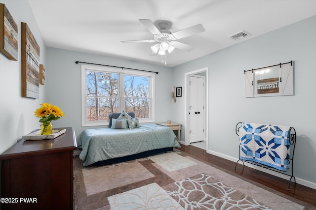 bedroom with hardwood / wood-style flooring and ceiling fan