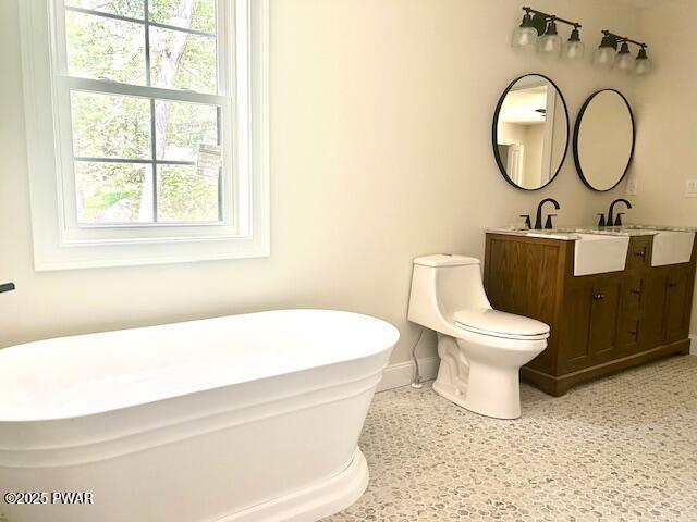 119 Lenape Dr, Milford, PA 18337 - bathroom with a freestanding bath and double vanity