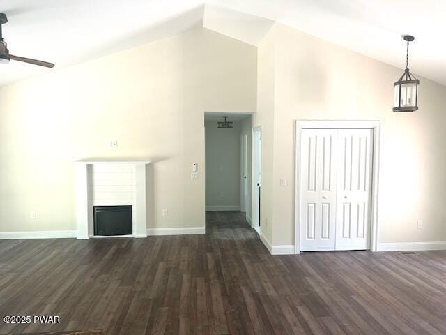 119 Lenape Dr, Milford, PA 18337 - unfurnished living room featuring high vaulted ceiling, dark wood-type flooring, a ceiling fan, and a fireplace
