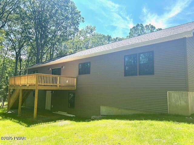 119 Lenape Dr, Milford, PA 18337 - rear view of property with a wooden deck and a lawn