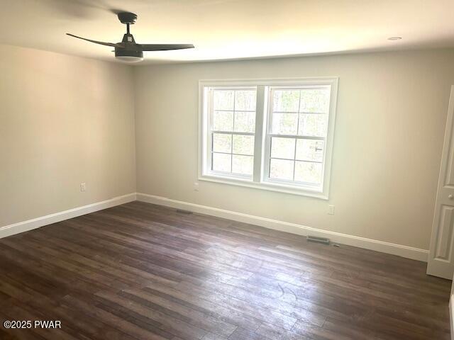 119 Lenape Dr, Milford, PA 18337 - empty room featuring a ceiling fan and dark wood-style floors