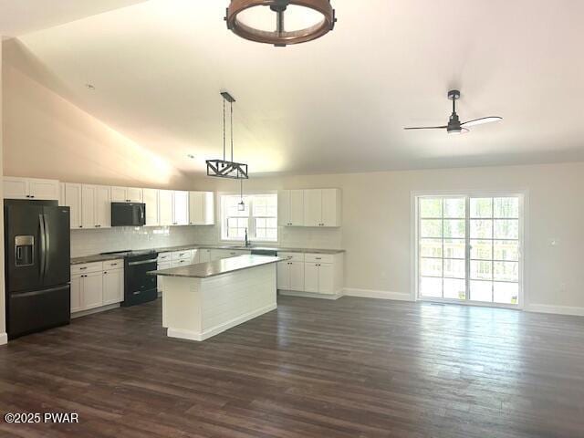 119 Lenape Dr, Milford, PA 18337 - kitchen featuring black appliances, a center island, white cabinets, lofted ceiling, and a ceiling fan