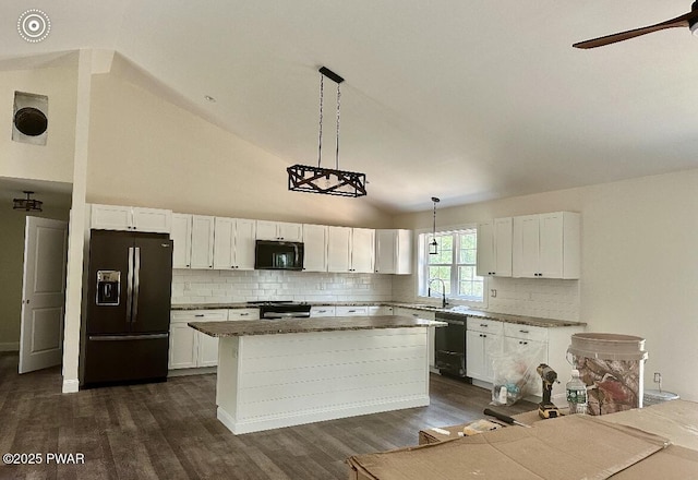 119 Lenape Dr, Milford, PA 18337 - kitchen featuring black appliances, a kitchen island, white cabinets, and high vaulted ceiling