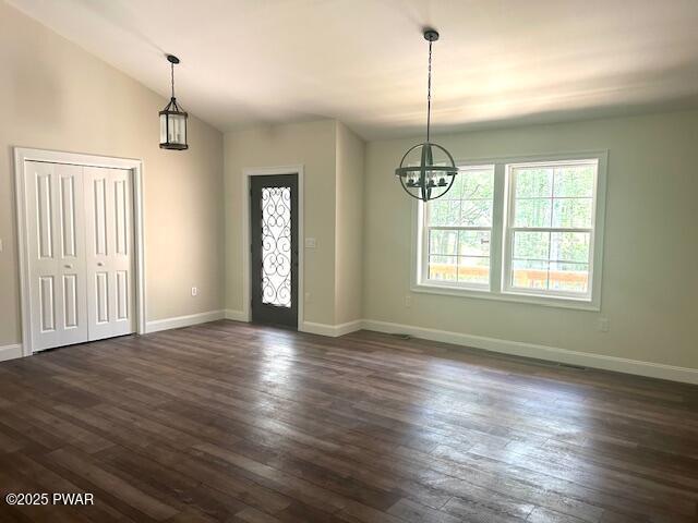119 Lenape Dr, Milford, PA 18337 - foyer entrance with a chandelier, dark wood-style flooring, and lofted ceiling