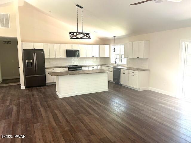 119 Lenape Dr, Milford, PA 18337 - kitchen featuring black appliances, dark wood finished floors, a kitchen island, and white cabinets