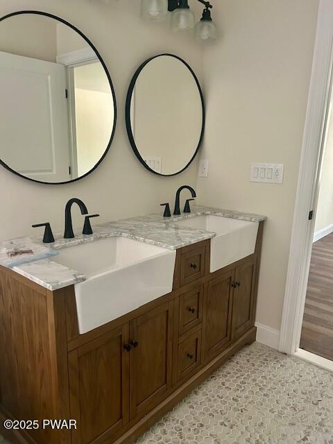 119 Lenape Dr, Milford, PA 18337 - full bathroom with double vanity and baseboards
