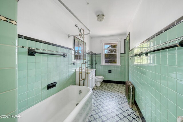 bathroom featuring toilet, tile walls, and sink