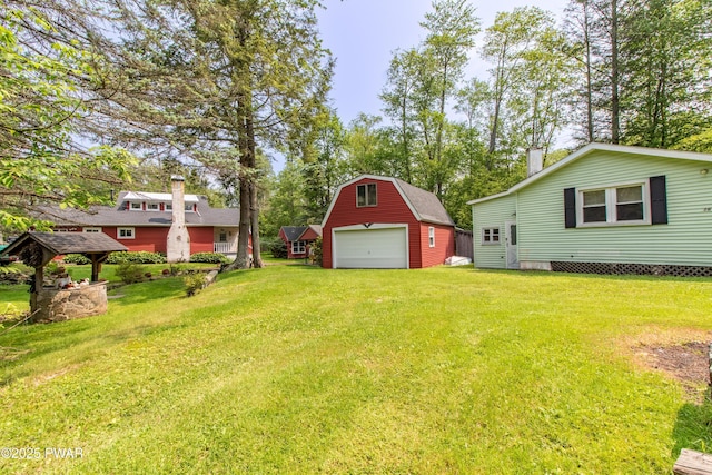 114 Springbrook Ln, Greentown, PA 18426 - view of grassy yard featuring a detached garage, an outbuilding, and driveway