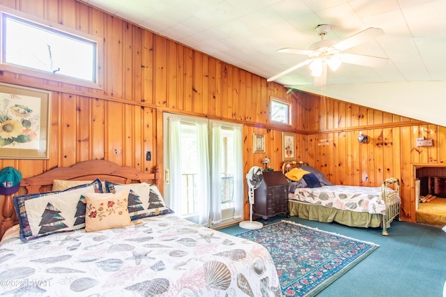 114 Springbrook Ln, Greentown, PA 18426 - bedroom with wooden walls, vaulted ceiling, and carpet flooring