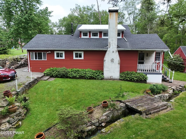 114 Springbrook Ln, Greentown, PA 18426 - view of front of home featuring a front lawn, a chimney, a porch, and roof with shingles