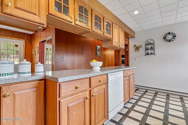 111 N Redwood Dr, Greentown, PA 18426 - kitchen with wood walls, a baseboard radiator, glass insert cabinets, white dishwasher, and recessed lighting