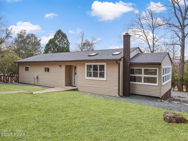 111 N Redwood Dr, Greentown, PA 18426 - ranch-style house featuring a chimney, roof with shingles, and a front lawn