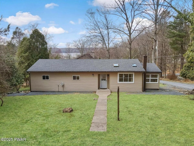 111 N Redwood Dr, Greentown, PA 18426 - ranch-style home with a chimney, a front lawn, and roof with shingles