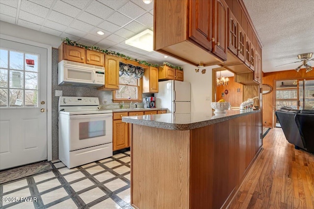111 N Redwood Dr, Greentown, PA 18426 - kitchen with light wood-style flooring, white appliances, recessed lighting, tasteful backsplash, and a paneled ceiling