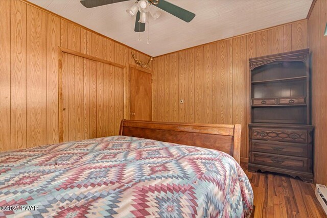 111 N Redwood Dr, Greentown, PA 18426 - bedroom with ceiling fan, wood finished floors, and baseboard heating