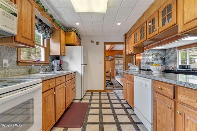 111 N Redwood Dr, Greentown, PA 18426 - kitchen with light countertops, white appliances, recessed lighting, glass insert cabinets, and a sink