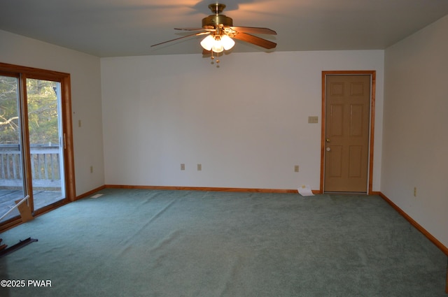 unfurnished room with baseboards, a ceiling fan, and carpet flooring