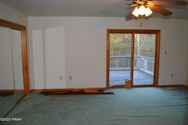 unfurnished room featuring baseboards, carpet floors, and ceiling fan