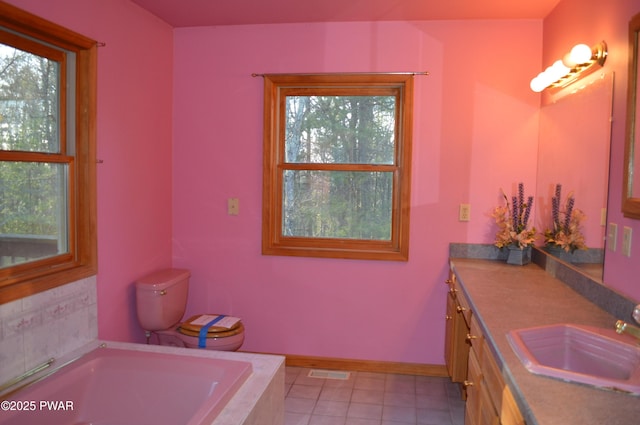 bathroom with visible vents, toilet, a garden tub, tile patterned floors, and vanity