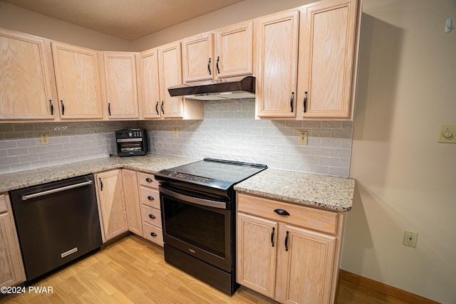 kitchen with light brown cabinets, light hardwood / wood-style flooring, electric range, stainless steel dishwasher, and light stone counters