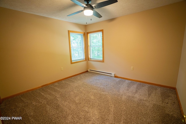 carpeted spare room with ceiling fan, a textured ceiling, and a baseboard heating unit