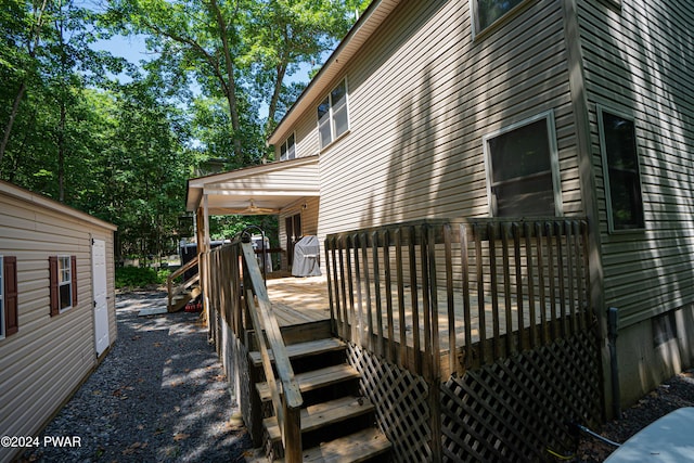 exterior space with ceiling fan