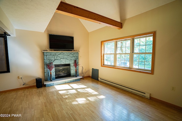 unfurnished living room featuring hardwood / wood-style flooring, vaulted ceiling with beams, a stone fireplace, and a baseboard radiator