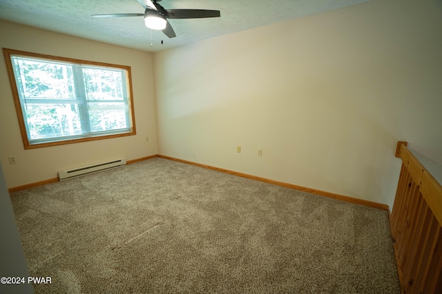 spare room featuring carpet flooring, ceiling fan, and a baseboard radiator