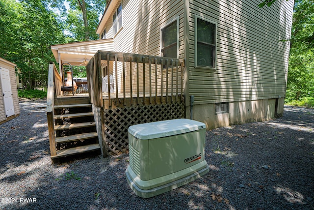 view of home's exterior featuring a wooden deck