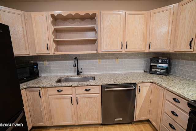 kitchen featuring light stone countertops, sink, light brown cabinets, backsplash, and black appliances