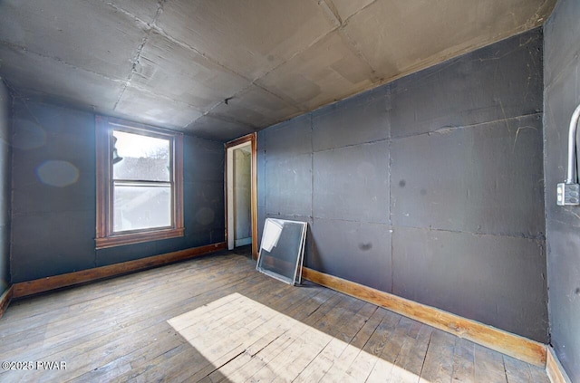 empty room featuring hardwood / wood-style flooring