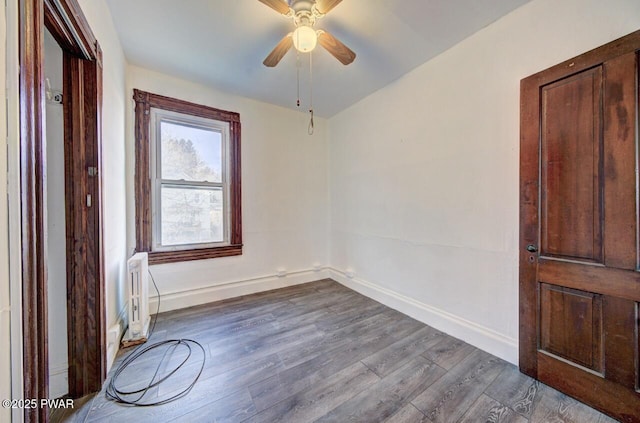 empty room with wood-type flooring and ceiling fan