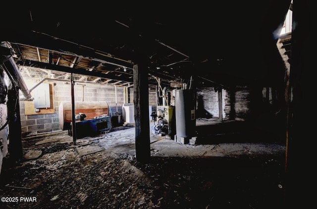 basement featuring washer / clothes dryer and water heater