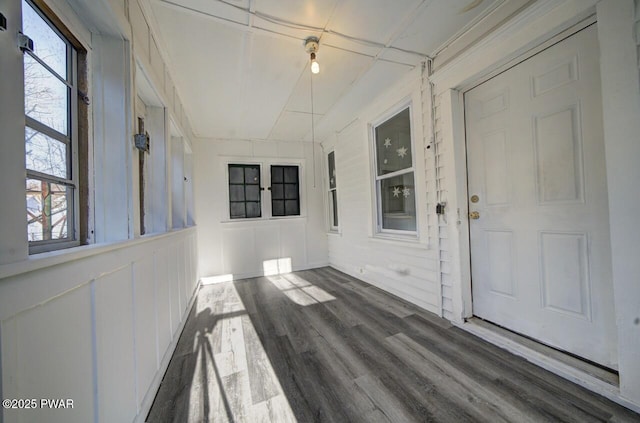 unfurnished sunroom featuring a wealth of natural light