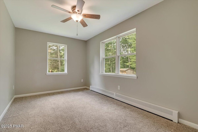 1039 Towpath Rd, Hawley, PA 18428 - carpeted spare room featuring a baseboard radiator, plenty of natural light, and a ceiling fan