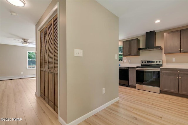 1039 Towpath Rd, Hawley, PA 18428 - kitchen featuring wall chimney range hood, electric range, dishwasher, light wood finished floors, and light countertops
