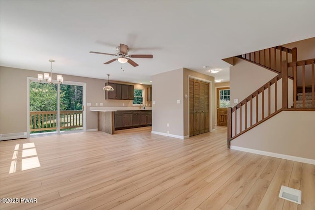 1039 Towpath Rd, Hawley, PA 18428 - unfurnished living room with light wood-style flooring, healthy amount of natural light, and ceiling fan