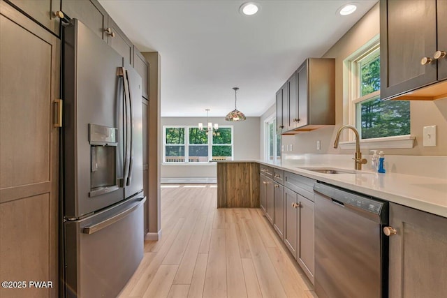 1039 Towpath Rd, Hawley, PA 18428 - kitchen featuring stainless steel appliances, plenty of natural light, light wood-style flooring, light countertops, and recessed lighting