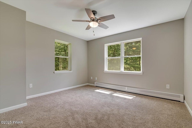 1039 Towpath Rd, Hawley, PA 18428 - unfurnished room with baseboard heating, carpet flooring, and plenty of natural light