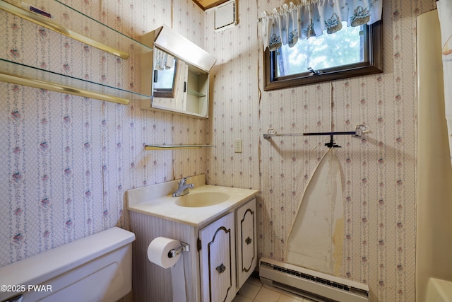 1086 Hampstead Rd, Bushkill, PA 18324 - bathroom featuring a baseboard radiator, toilet, vanity, tile patterned floors, and wallpapered walls
