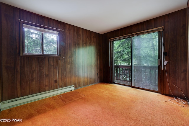 1086 Hampstead Rd, Bushkill, PA 18324 - carpeted empty room featuring baseboard heating, healthy amount of natural light, and wooden walls