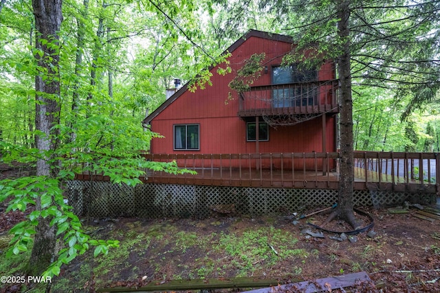 1086 Hampstead Rd, Bushkill, PA 18324 - rear view of property featuring a chimney and a wooden deck
