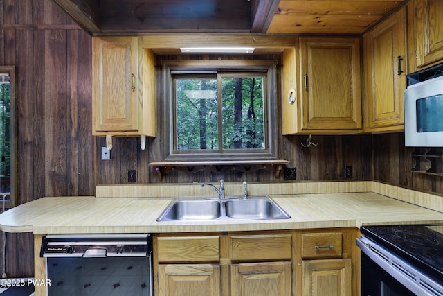 1086 Hampstead Rd, Bushkill, PA 18324 - kitchen featuring black dishwasher, a sink, stainless steel microwave, and wood walls