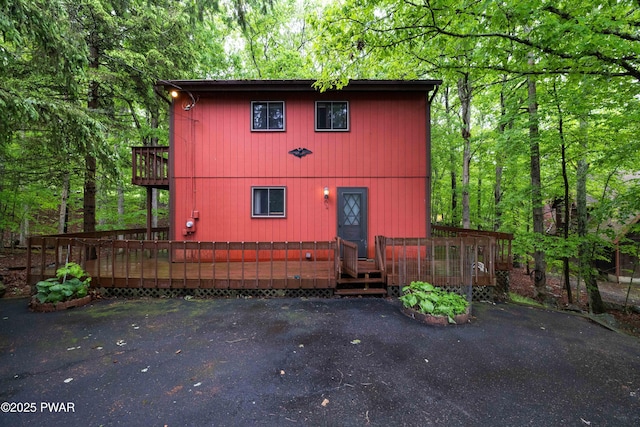 1086 Hampstead Rd, Bushkill, PA 18324 - chalet / cabin with a deck and a wooded view