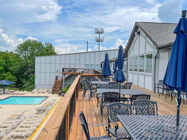 1086 Hampstead Rd, Bushkill, PA 18324 - wooden terrace with outdoor dining area and a community pool