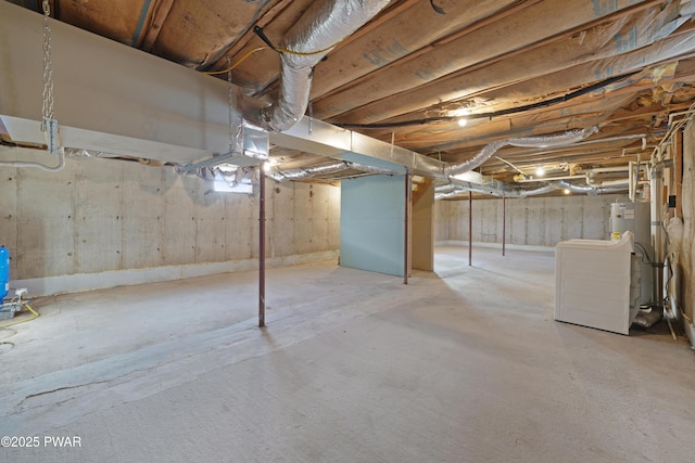 basement featuring washer / clothes dryer and gas water heater