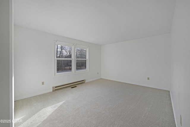 carpeted empty room featuring a baseboard radiator