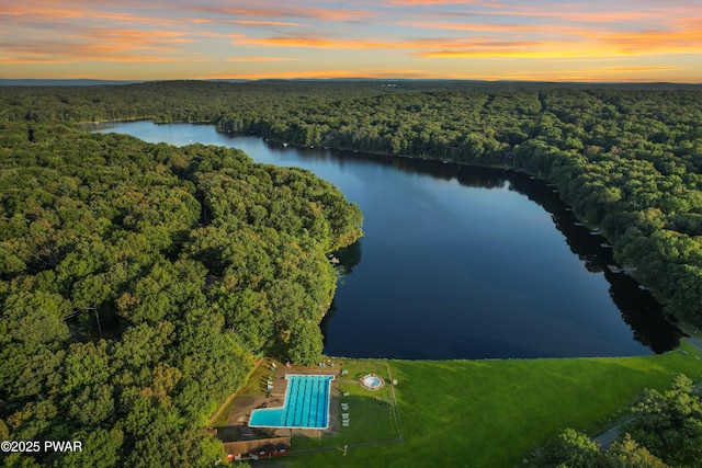 aerial view at dusk with a water view