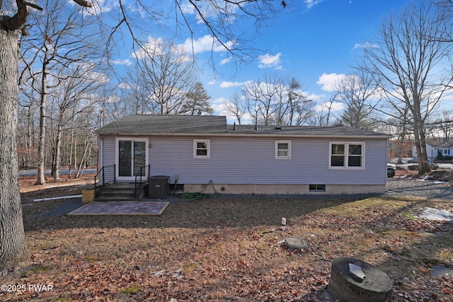 back of house featuring central AC unit