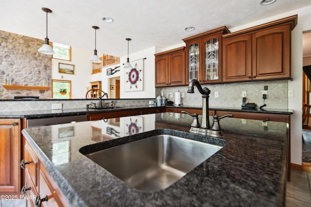 119 Canoebrook Dr, Hawley, PA 18428 - kitchen with a sink, decorative light fixtures, dark stone countertops, backsplash, and recessed lighting